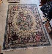 Blue floral area rug - Mark Van Hook, Auctioneer