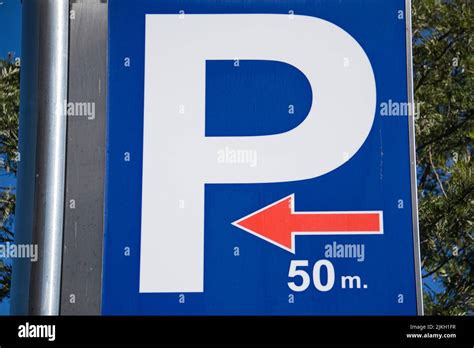 A blue parking sign indicating a parking lot 50 meters away Stock Photo ...