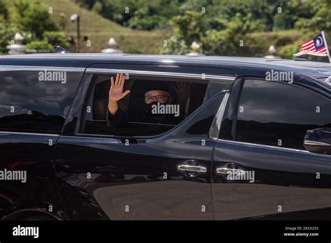 New Malaysian Prime Minister Ismail Sabri Yaakob waves from a car, as ...