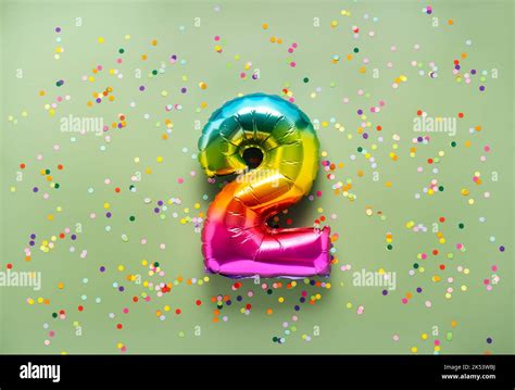 Colorful balloon number 2 on light green background. New Year of ...