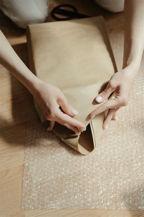 Woman in Brown Dress Holding Her Brown Leather Bag · Free Stock Photo