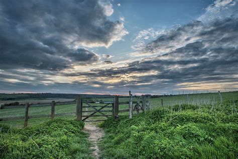 Beautiful English countryside landscape over fields at sunset ...