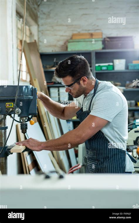 Carpenter using a drill Stock Photo - Alamy