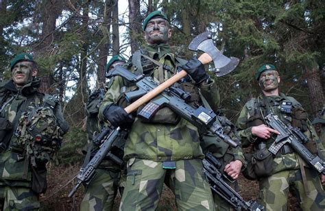 Swedish soldiers posing with their battle axe : pics