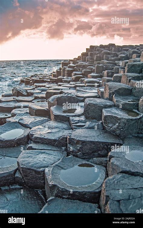 Sunset with the Giant's Causeway in the foreground Stock Photo - Alamy