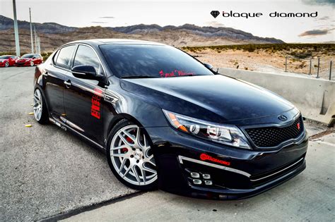 Eye-Catching Black Debadged Kia Optima with Red Accents — CARiD.com Gallery