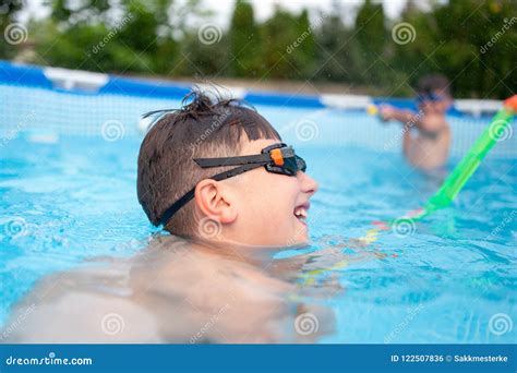 Happy Little Kids in Pool Shooting with Water Gun Stock Photo - Image ...