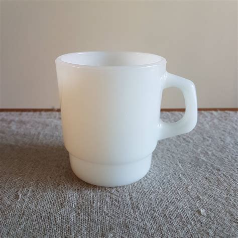 A single stacking Fire King coffee cup by Anchor Hocking, plain white // milk glass mugs, office ...