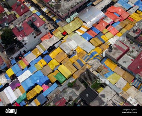 Archival 2002 aerial view of colorful tarps filling the streets at the ...