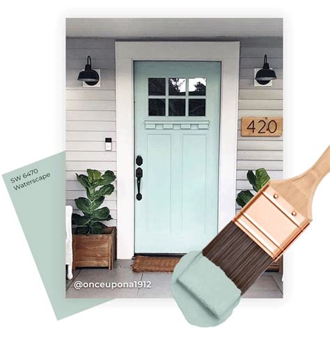 a paintbrush with a green door and white house numbers on the front porch next to it