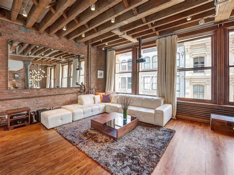 Open Plan Apartment with Exposed Wood Beams and Iron Columns