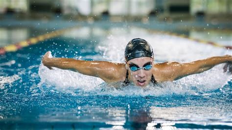 Premium Photo | Front view of a powerful elite female swimmer ...