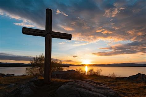 Premium AI Image | A cross on a hill with a sunset in the background