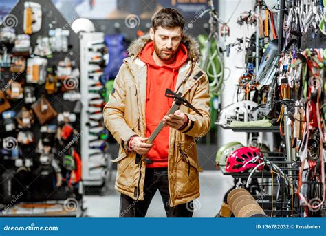 Man Choosing Choosing Mountaineer Equipment in the Shop Stock Photo - Image of hiking, camping ...