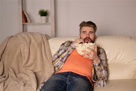 Single Man on the Couch Watching TV Stock Image - Image of enjoy, couch ...