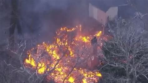 Fire engulfs home in flooded New Jersey area: video