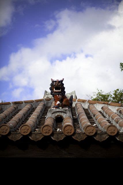 Shisa statue on the rooftop in Okinawa, Japan - Shisa is a traditional Ryukyuan decoration ...