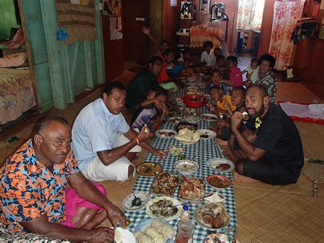 This is an image of a Fijian family eating either their breakfast or ...