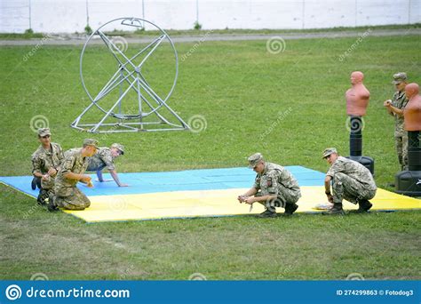 Soldiers Washing the Wrestling Mat Preparing it for Competition ...