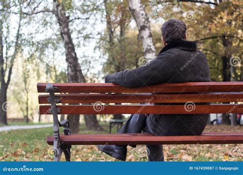 Portrait of a Pensive Senior Man Sitting on the Bench, in the Public ...