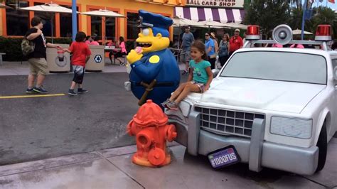 Thalia with the Simpsons police car at Universal Studios - YouTube