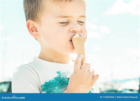 Close-up of a Child Eating an Ice Cream Cone Stock Image - Image of cheerful, detail: 116653263