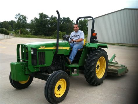 The Long Dirt Road: His big green tractor!