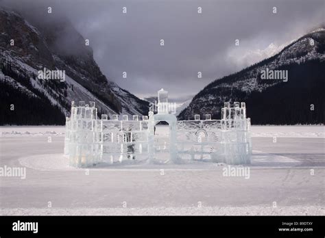 Ice castle on the lake behind the Chateau Lake Louise Hotel near Banff ...