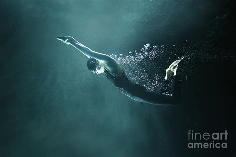 Man Swimming Underwater On Black by Stanislaw Pytel