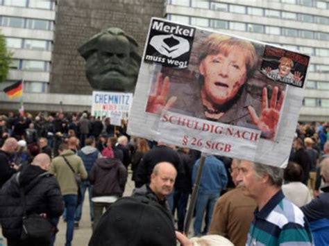 Germany protest: Thousands of supporters, opponents of Angela Merkel's ...