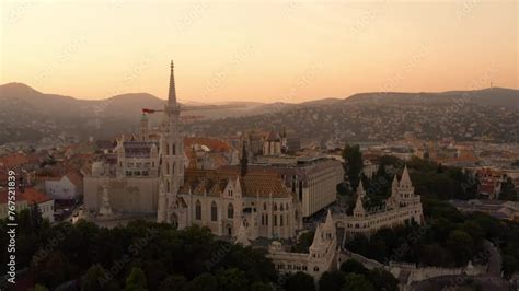 Panoramic view of Buda Castle Hill during sunset. Burning orange sunset ...