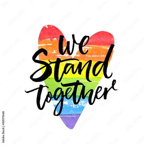 We stand together. Inspirational LGBT slogan han dwritten on rainbow ...