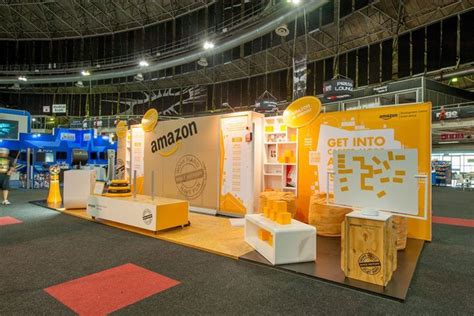 an exhibit booth with bananas and other items on display in the middle of a large building