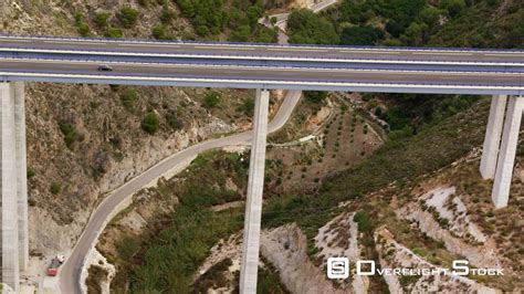 OverflightStock™ | TS Aerial View of Car Traveling Along Freeway Bridge ...