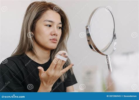 Woman Wearing Make Up in Front of the Mirror in White Bright Room. Stock Image - Image of ...