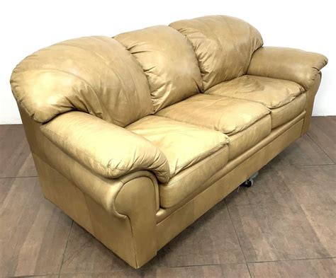 Lot - Contemporary Saddle Arm Pillow Top Leather Sofa