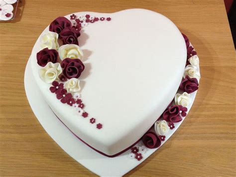 Heart Shaped Wedding Cake With Whimsical Flowers - CakeCentral.com