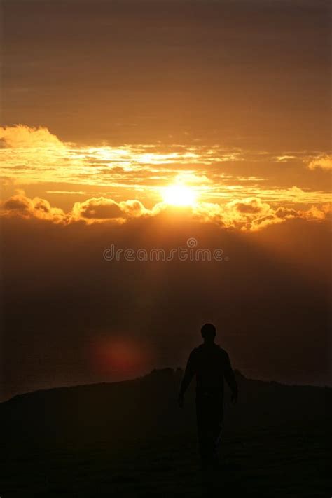 Man Walking Off Into Sunset Stock Photo - Image of relaxing, golden: 17141770