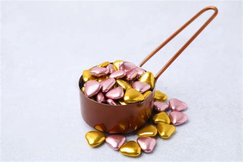 Metal Scoop and Delicious Heart Shaped Candies on White Table Stock Photo - Image of present ...