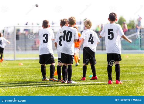 Kids Football Team. Young Boys Watching Soccer Match. Football Tournament Competition in the ...