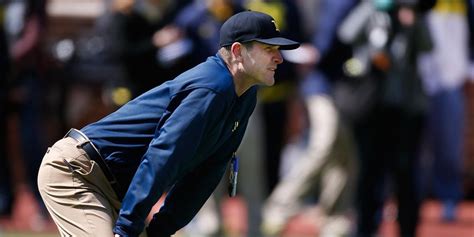 Michigan football coach Jim Harbaugh explains why he always wears ...