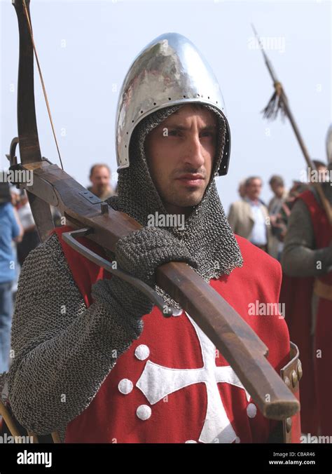 Man dressed as medieval crossbow man in costumed procession in Amalfi ...