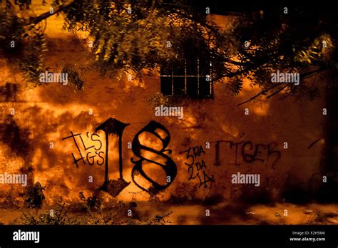 A Barrio 18 gang graffiti, a symbol marking the gang's territory, is ...