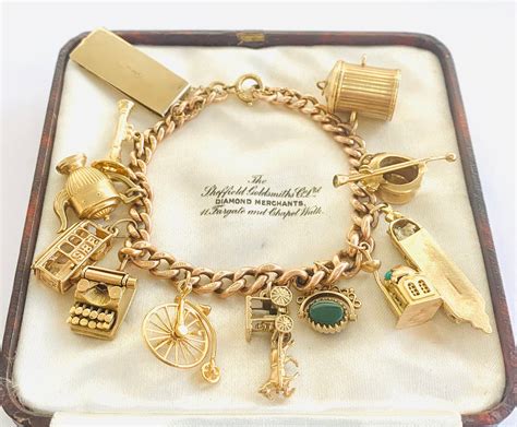 Stunning heavy antique 9ct rose gold bracelet with 12 vintage gold charms - fully hallmarked - 49gms