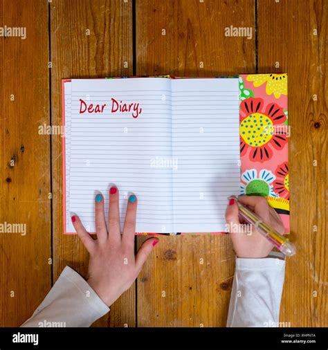 Child writing in diary hi-res stock photography and images - Alamy