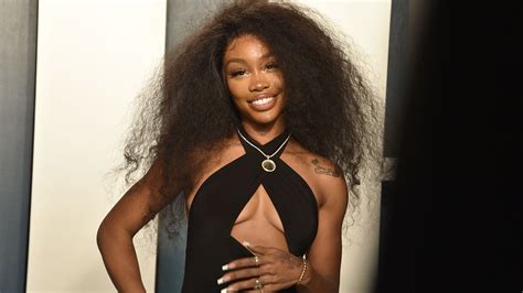 SZA Tries on Colorful Wigs in a New TikTok Video — Watch | Allure