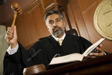 Male Judge Knocking Gavel Stock Photo by ©londondeposit 21862015