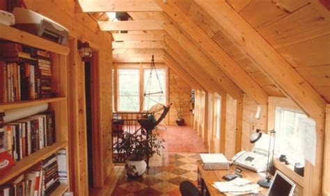 an attic office with wooden walls and flooring