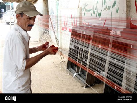 A man prepares Manjha (special thread for kite flying) to earn his ...