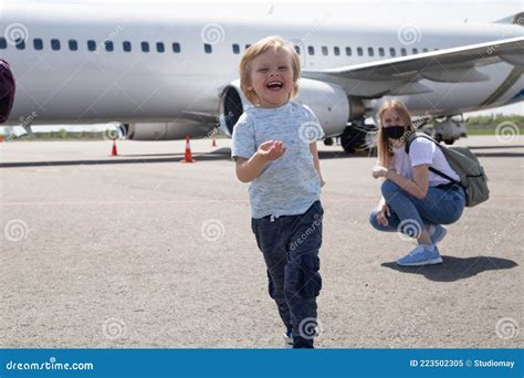 Happy Family on the Background of the Plane. Child Run Away from His Mom Stock Image - Image of ...